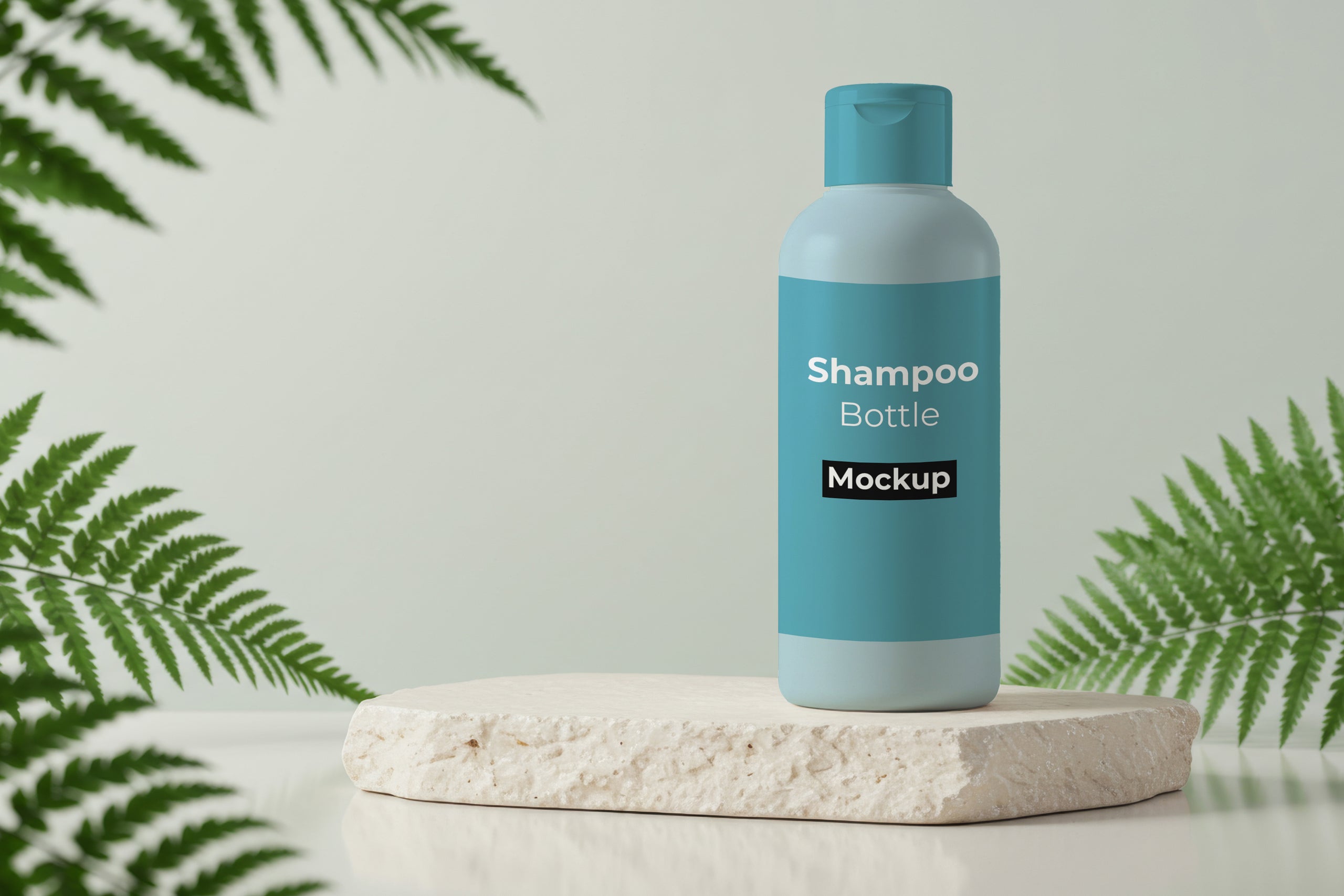 Free shampoo bottle mockup on stone pedestal with ferns