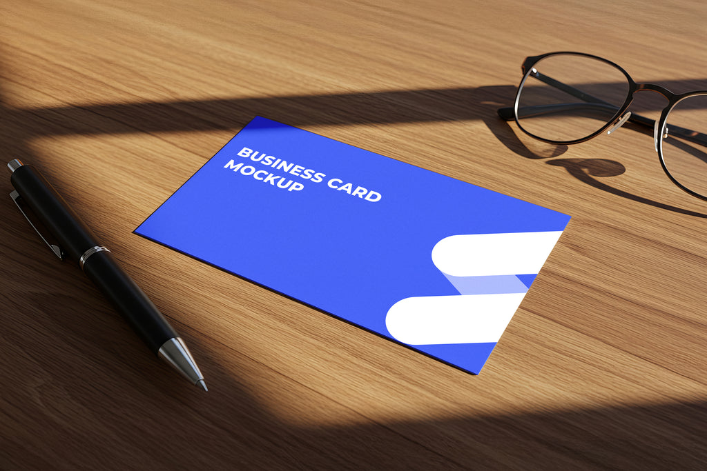 Free Business Card on Wooden Desk Mockup
