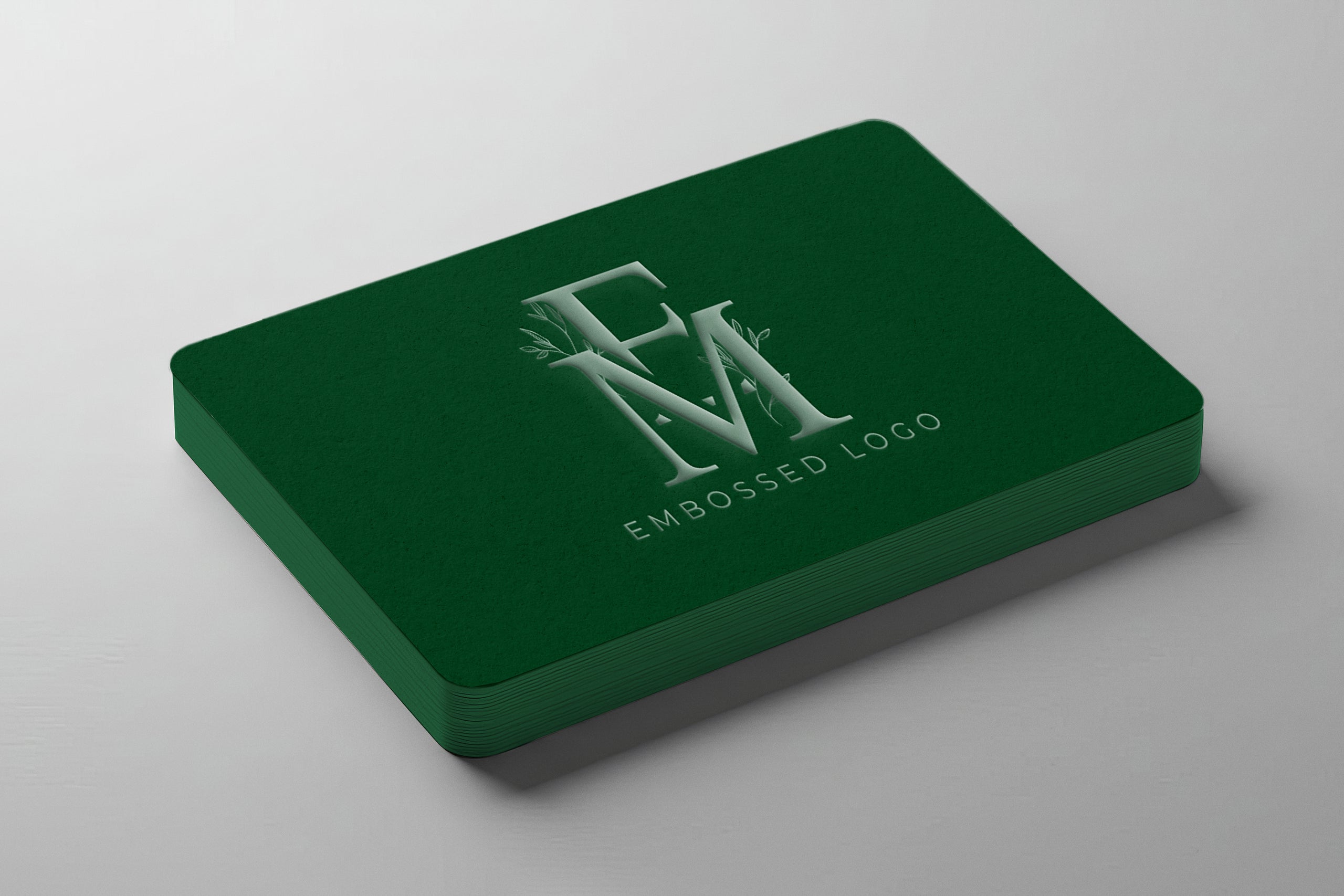 Free embossed logo mockup on stacked paper cards