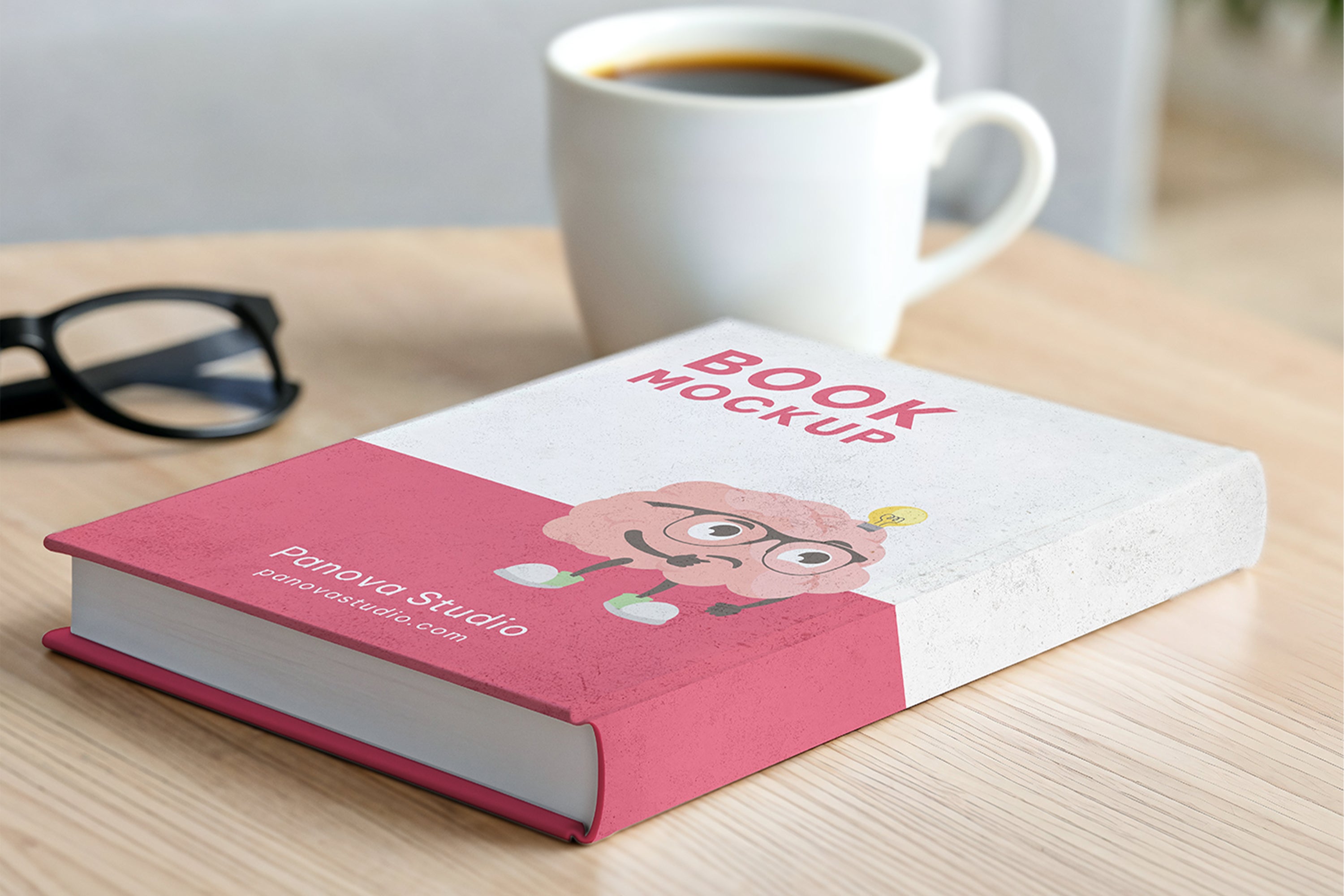 Free hardcover book on table mockup with coffee cup and glasses