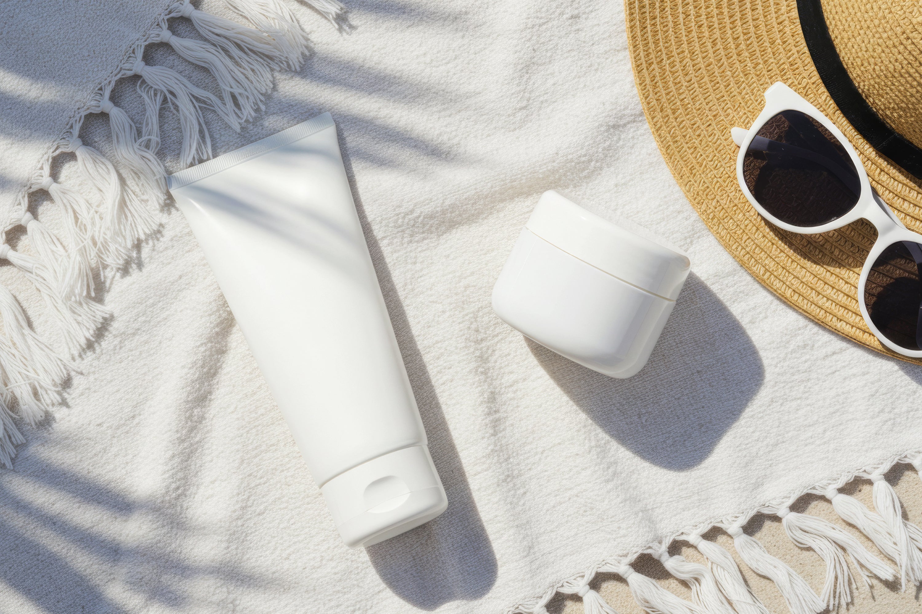 Fee Plastic Tube and Cream Jar on White Towel Mockup