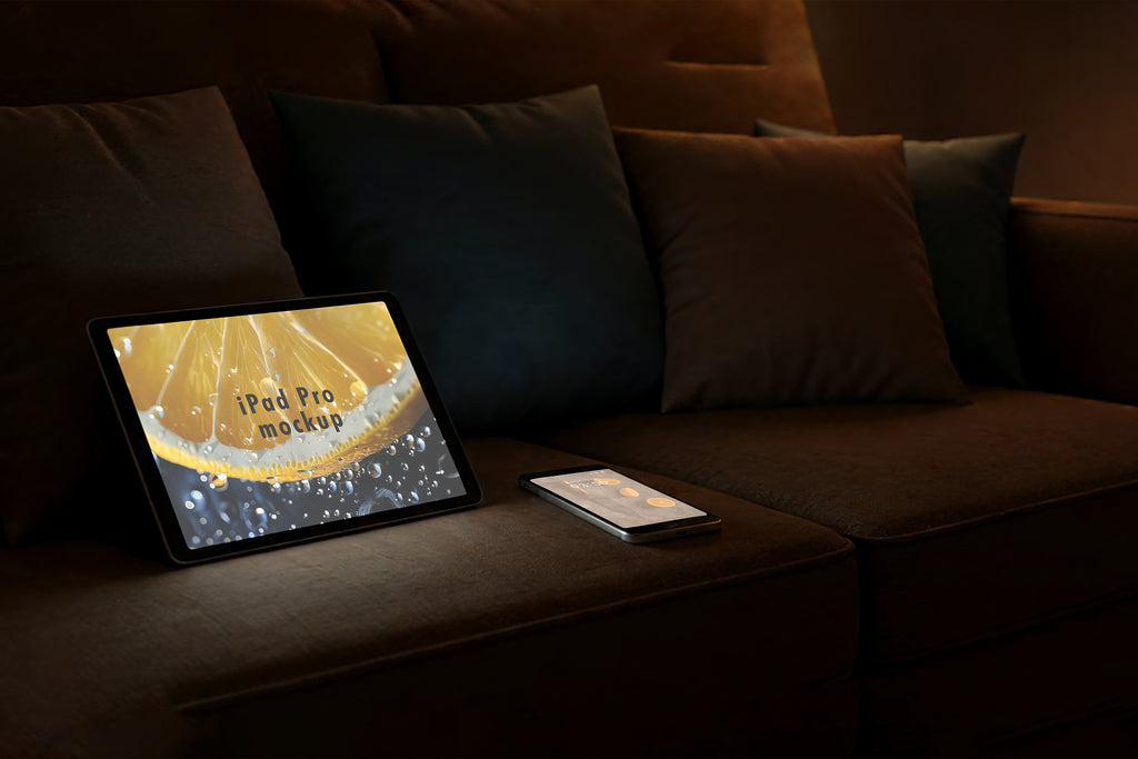 Free Tablet and Phone on Sofa Mockup