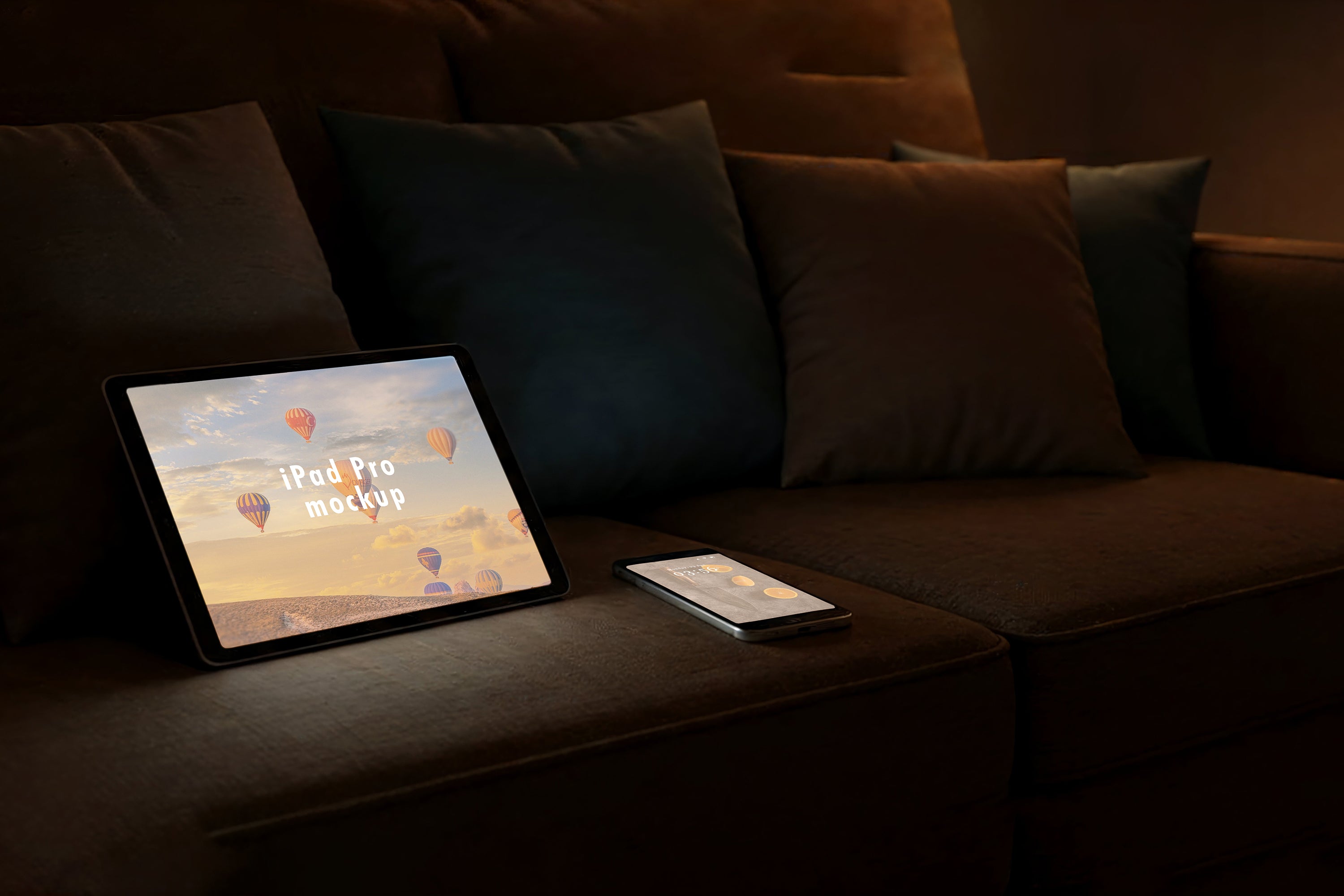 Free Tablet and Phone on Sofa Mockup