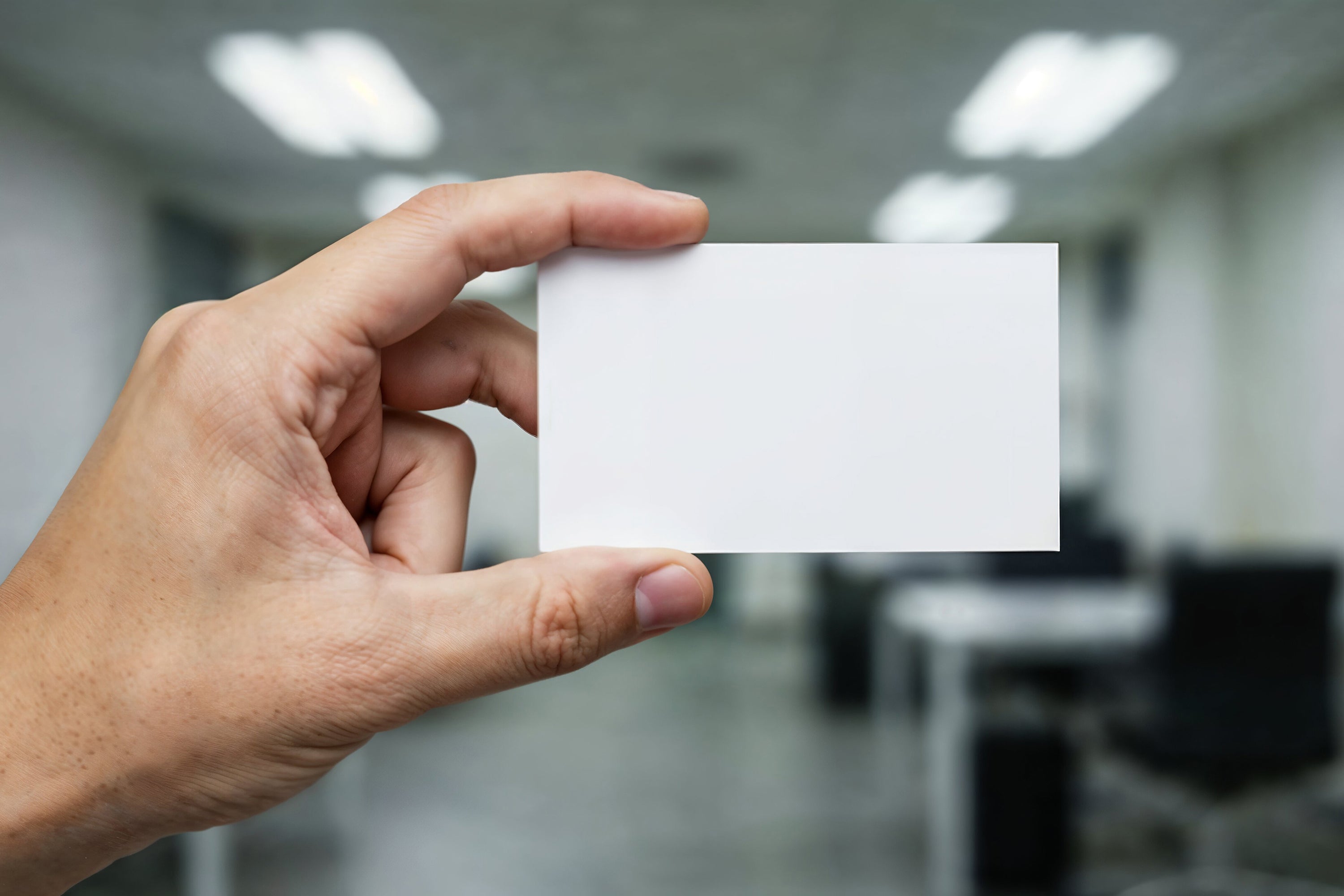 Free Business Card Held in Hand Mockup