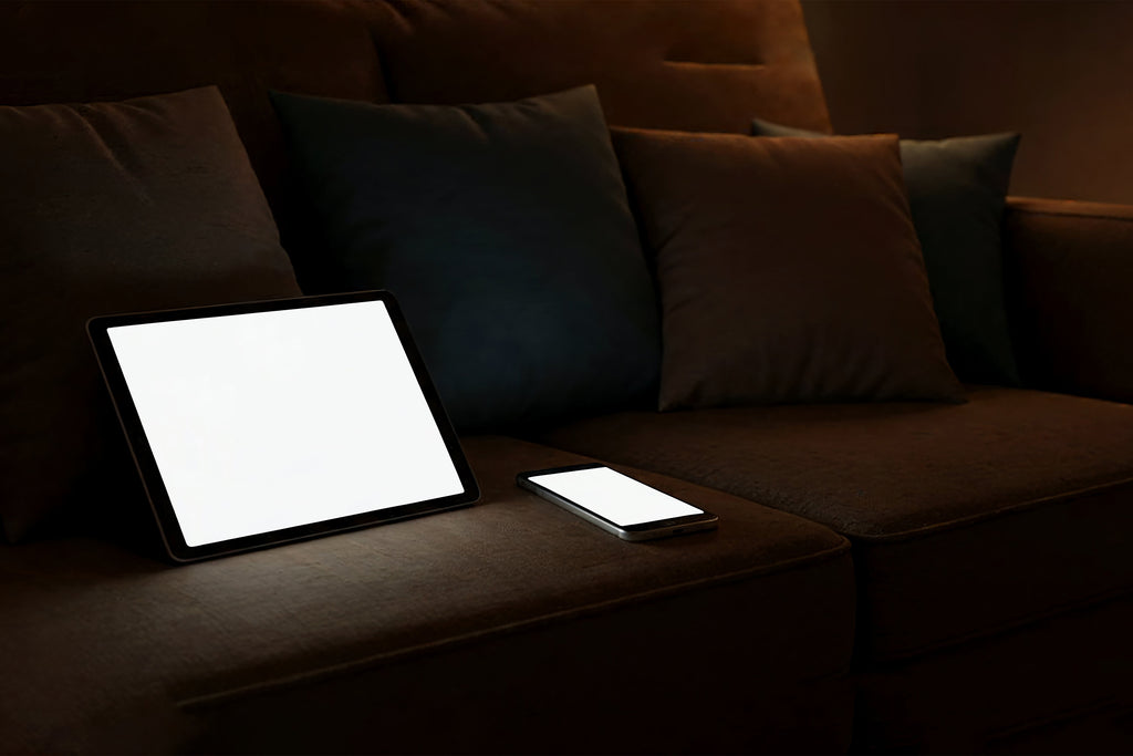 Free Tablet and Phone on Sofa Mockup