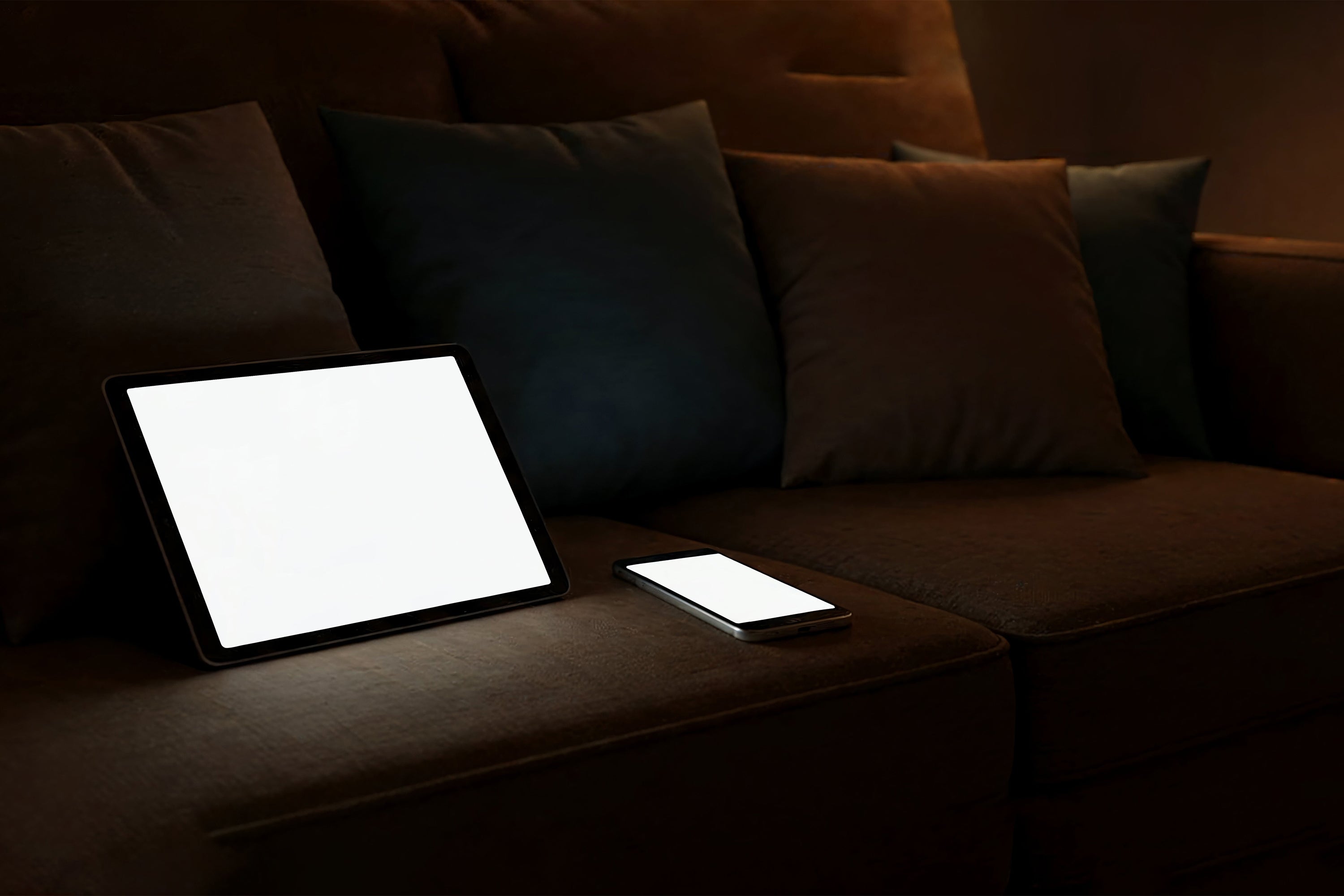 Free Tablet and Phone on Sofa Mockup